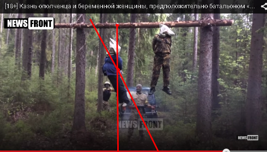 [18+] Казнь ополченца и беременной женщины,