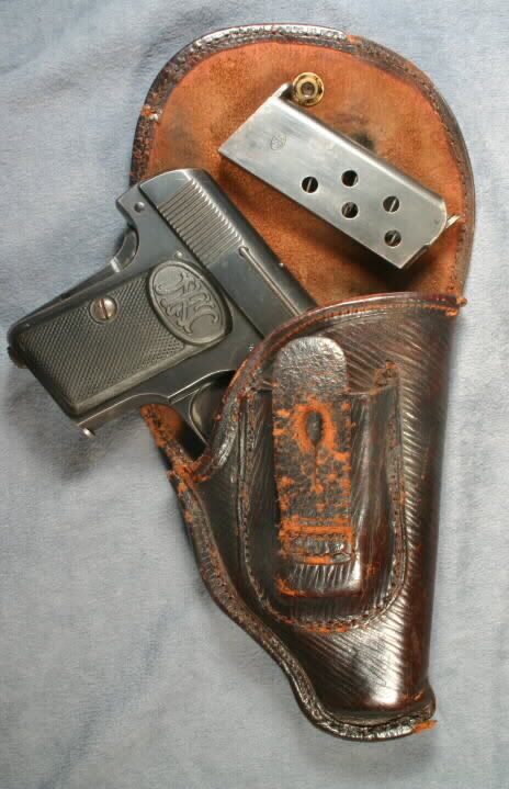 Пистолет Colt Model 1903 Pocket Hammerless - шедевр оружейной эстетики.