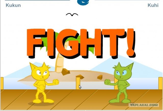 Драка двух котов за кусок колбасы