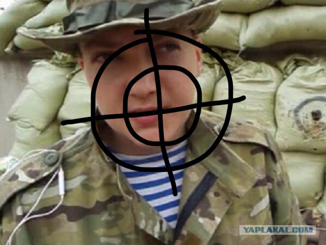Тернопольцы подрисовали на портрете Савченко в районе головы пятна крови и написали слово "убийца".